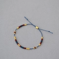 Handgefertigtes minimalistisches Perlenarmband mit roten blauen und goldenen Perlen - Rot Blau Gold
