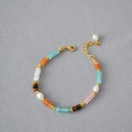 Close-up of color-block beaded necklace with freshwater pearls and tiger eye stones - Bracelet Style 1