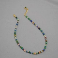 Colorful Bohemian beaded necklace with faceted stones and gold spacers on gray background - Multicolor 2