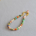 Colorful natural stone bead necklace with golden accents and adjustable chain extension - Bracelet