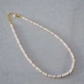Detail view of pink cylinder stone beads with gold spacer beads and lobster clasp closure - Watermelon Pink