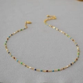 Minimalist gold clavicle chain necklace with colorful enamel dots on a grey surface - Colorful Enamel Drip Glaze Bead Style