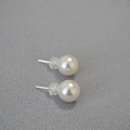 Macro view of round faux pearl earrings with 925 silver posts and silicone backs - 10mm / 650 Color Style