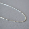 Detailed close-up of a minimalist silver geometric rectangular link chain necklace - Short Style / Antique Silver