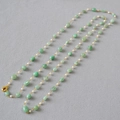 Detail of handmade long necklace with green stones, white pearls, and gold clasp - Green Stone