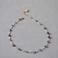 Detail of amethyst and pearl beaded necklace with gold chain and lobster clasp - Necklace / Purple