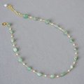 Minimalist necklace featuring natural green stone beads and white pearls on gold chain - Necklace / Green