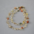 Detail of bohemian necklace with natural colorful stones and white freshwater pearls - Mixed Color Stone