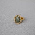 Detailed close-up of oval green labradorite stone with gold-plated beaded edge bezel ring - Oval Labradorite