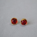 Detailed macro view of vintage red gemstone earrings with textured gold irregular settings - Deep Red Lava Texture Round Stud Earrings (1)