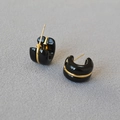 Minimalist C-shaped hoop earrings in black enamel with sleek gold wire detailing - Black