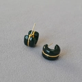 Detail of C-shaped resin hoop earrings in dark green with a gold metallic line inlay - Malachite green