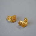 Macro detail of French vintage gold layered irregular wire wrap hoop earrings - Gold