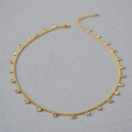 Minimalist gold plated brass necklace with dangling round cubic zirconia crystals - Gold