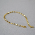 Elegante bracciale in ottone dorato con perline sfaccettate e catena di regolazione - Oro