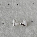 Polished S925 sterling silver heart-shaped stud earrings on a gray jewelry display - Heart / Silver