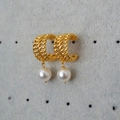 Elegant gold braided hoop earrings with round white pearl pendants on a gray display - Gold (MYE0066-GD-Z)
