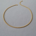 Elegante collana a sfere in ottone placcato oro con una chiusura a moschettone sicura - Oro