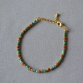 Artistic beaded bracelet with turquoise and orange beads with golden lobster clasp - Picasso Style Beaded (MYN0337)