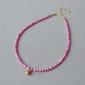 Roze en witte kralenketting met een gouden ster hanger en sprankelend steen detail - Schelp Patchwork