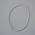 Detail of silver-grey pearl necklace with a unique figure-eight metal clasp - Silver Gray Necklace 4mm