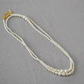Close-up of double-layer gradient pearl necklace with gold-plated lobster clasp and chain - Cream Pearl