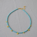 Collana bohémien con perline turchesi, ciondoli a moneta d'oro e chiusura regolabile - Turchese