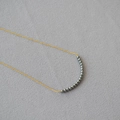 Minimalist gold chain necklace with curved grey pearls for daily elegant commute style - Tahiti Dark Grey