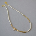 Detailed view of pearl and gold branch necklace with adjustable lobster clasp closure - Gold