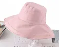 Detailed view of pink sun hat with golden Seek your beauty embroidery on brim - One Size 58cm / Pink