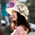 Detail of hand-woven straw hat featuring a large elegant mesh bow and breathable openwork - One Size 58cm / Beige
