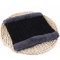 Detail view of black chenille neck warmer with thick grey fleece lining on straw mat - 56-60cm / Black