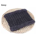 Detail of dark grey cable knit neck warmer with thick thermal lining on woven mat - 56-60cm / Gray