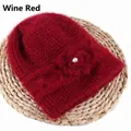 Winter wine red knitted hat for women with elegant crochet flower and pearl detail - Elastic 56-59cm / Burgundy
