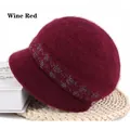 Detailed texture of wine red knit hat with shimmering sequin band and soft faux fur material - 56-59cm / Burgundy