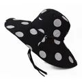 Detail of wide brim sun hat with large white polka dots and adjustable black chin strap - One Size 58cm / Black