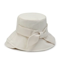 Detail of elegant beige bucket hat featuring a large fabric bow on high-quality canvas - 56-58cm / Beige