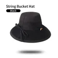 Detail of black cotton bucket hat showing woven brim texture and thin decorative cord - One Size 58cm / Black