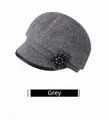 Close-up of grey plaid wool beret cap featuring fabric flower detail and leather trim - Adjustable 56-59cm / Gray