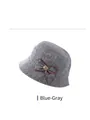 Detailed blue grey knitted bucket hat featuring a decorative bow and golden metal flower buckle - Adjustable 56-59cm / Striped Blue Gray