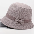 Detailed view of mauve floral fabric and side bow knot on elderly women's sun hat - All-over Floral Print Chocolate