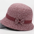 Detail of floral bucket hat with burgundy fabric, small white blossoms and silk ribbon bow - All-over Floral Print Dark Red