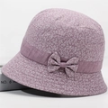 Detailed macro view of purple floral bucket hat with delicate bow and cotton fabric texture - All-over Floral Print Purple