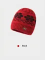 Close-up of red winter knit hat with floral jacquard pattern and golden bow detail - Elastic 56-59cm / Red
