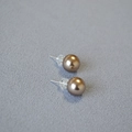Macro view of champagne brown pearl stud earrings with 925 silver needles and silicone backs - 10mm Stud Earrings