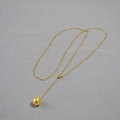 Elegante collana a Y con perla dorata e sottile catena scintillante raffinata - Perla finta dorata