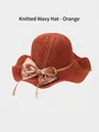 Orange knitted sun hat with wavy brim featuring a champagne bow and houndstooth detail - One Size 58cm / Orange Red