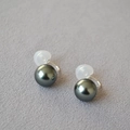 Detail of dark grey round pearl clip-on earrings with clear spiral non-pierced resin backs - Tahitian Gray 12mm