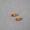 Minimalist gold plated red agate stud earrings with high polished finish on grey background - Red Agate