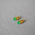 Detailed macro view of gold-plated stud earrings featuring green agate stones - Green Agate